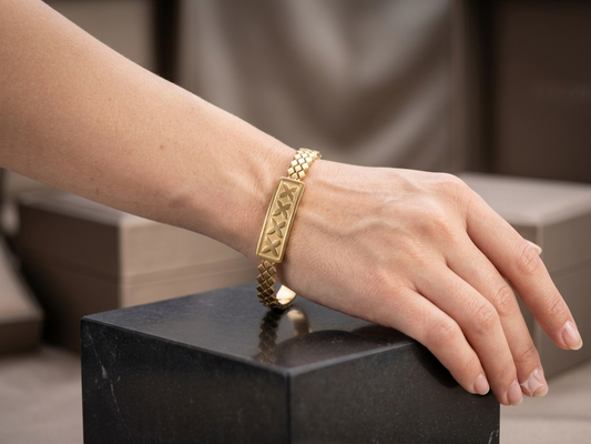 Embossed Cross-Motif Gold Bangle